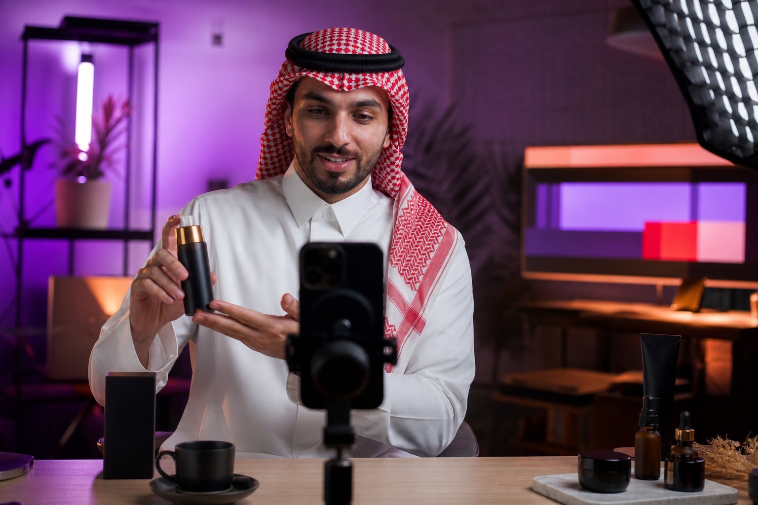 Saudi creator producing a paid social campaign video in a studio.
